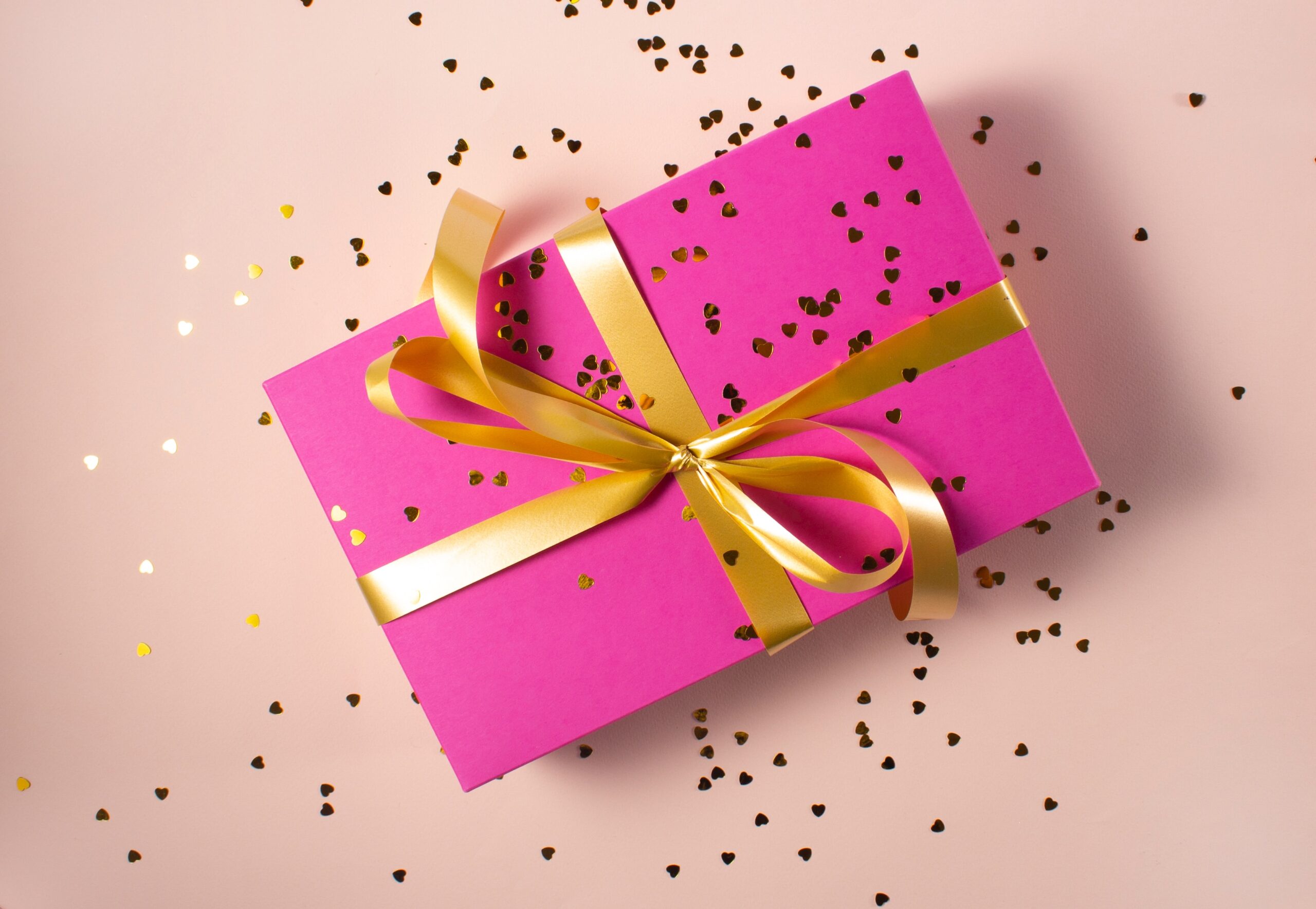 Pink gift with confetti